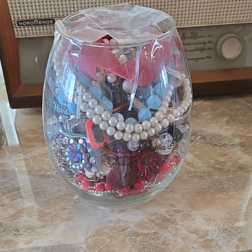 Colorful Jewelry Assortment in Glass Vase